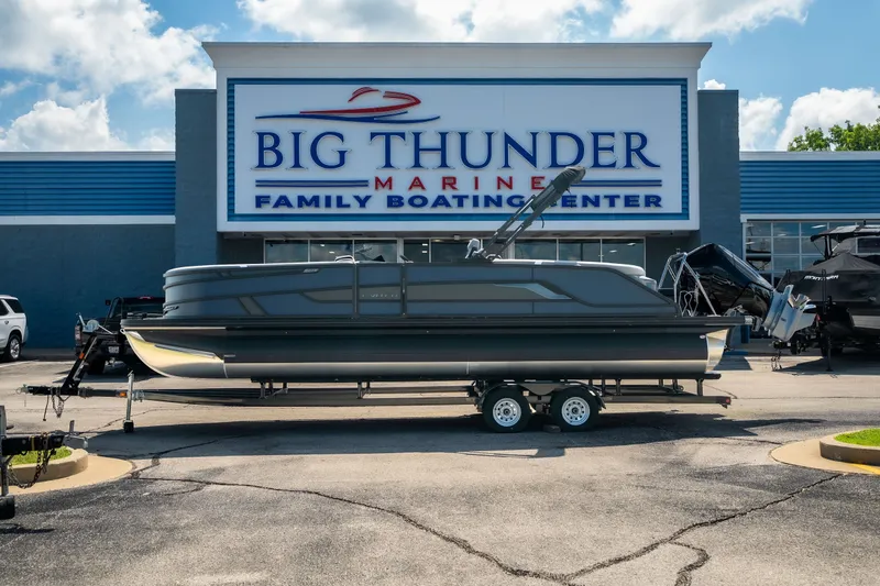 Slide: The Image of 2026 Evotti 725QL boat displayed at Big Thunder Marine dealership. - 1