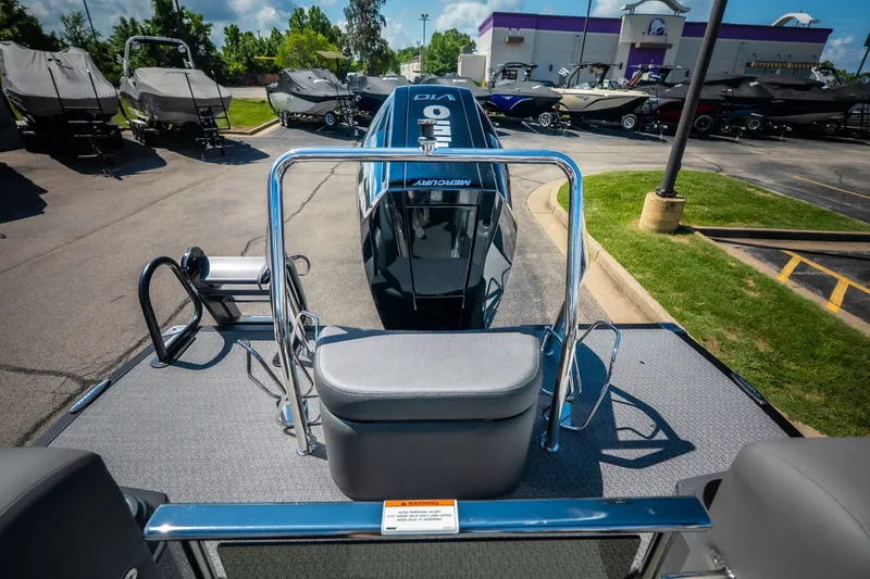Slide: The Image of 2026 Evotti 725QL boat displayed outdoors with other boats in the background. - 29