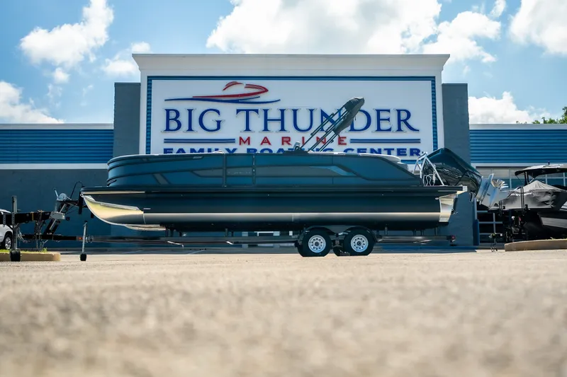 Slide: The Image of 2026 Evotti 725QL boat on trailer at Big Thunder Marine dealership. - 17