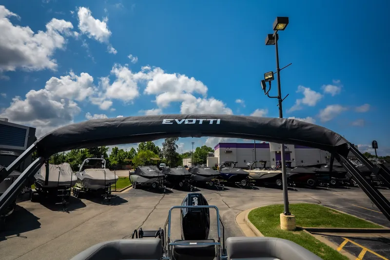 Slide: The Image of Outdoor display of 2026 Evotti 725QL boats under a clear blue sky. - 45