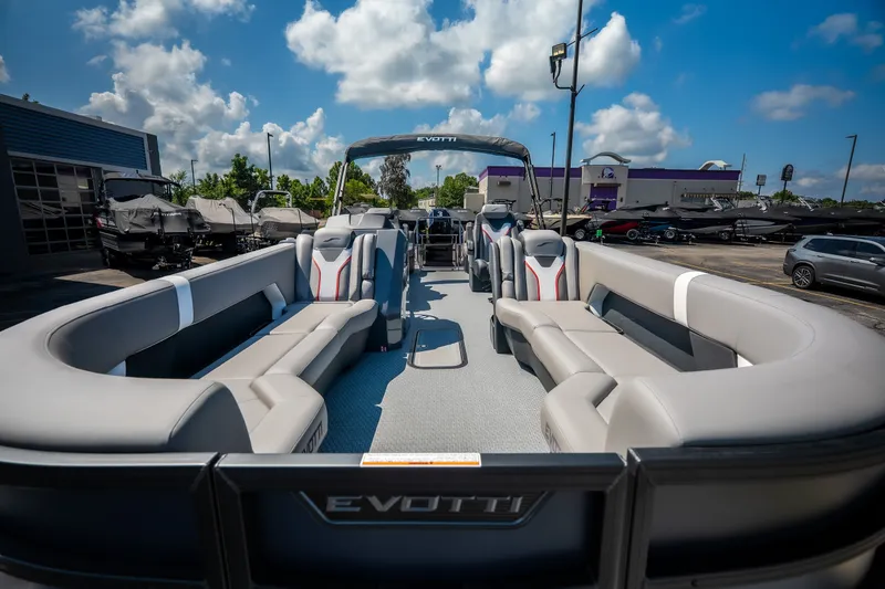Slide: The Image of 2026 Evotti 725QL luxury pontoon boat with spacious seating, showcased outdoors under a blue sky. - 22