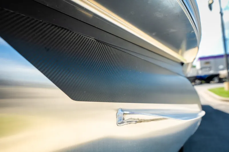Slide: The Image of Close-up of 2026 Evotti 725QL boat exterior with sleek design and carbon fiber detailing. - 20