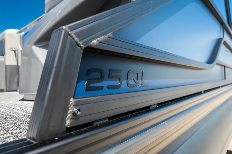 Slide: The Image of Close-up of 2026 Evotti 725QL boat exterior with "25QL" marking. - 11