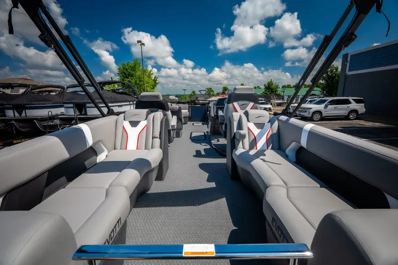 Slide: The Image of Luxurious 2026 Evotti 725QL boat interior with plush seating under a clear blue sky. - 51