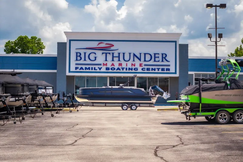 Slide: The Image of Big Thunder Marine Family Boating Center with Evotti 725QL boats displayed outside. - 55