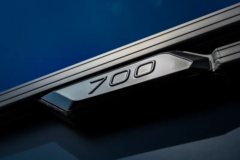 Slide: The Image of Close-up of Evotti 725QL 2026 model badge on a sleek metallic surface. - 9