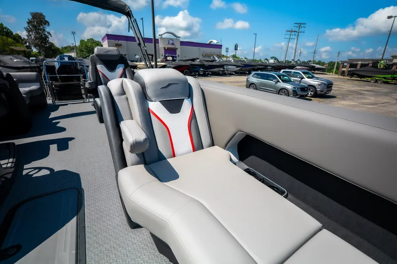 Slide: The Image of 2026 Evotti 725QL boat interior with luxurious seating and modern design in a dealership setting. - 30