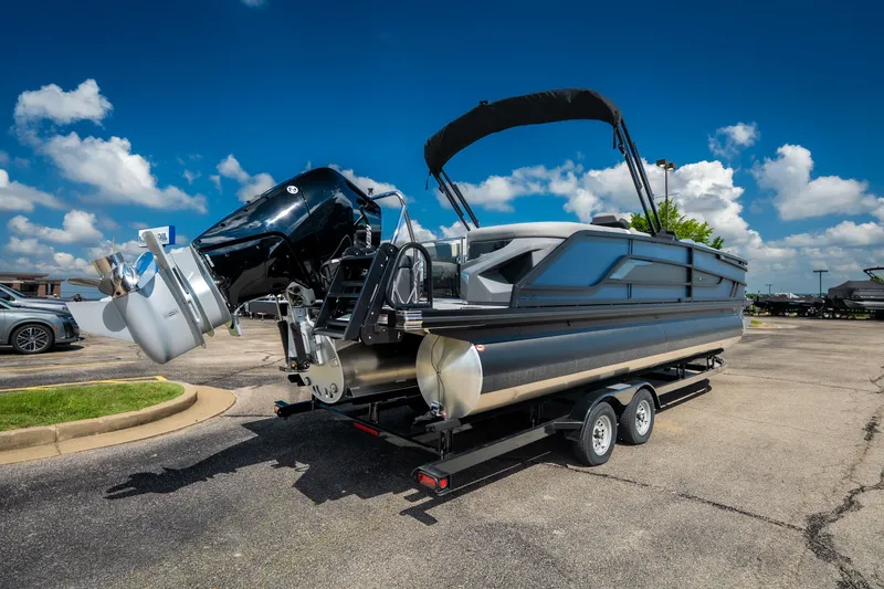 Slide: The Image of 2026 Evotti 725QL pontoon boat on trailer under clear blue sky. - 12