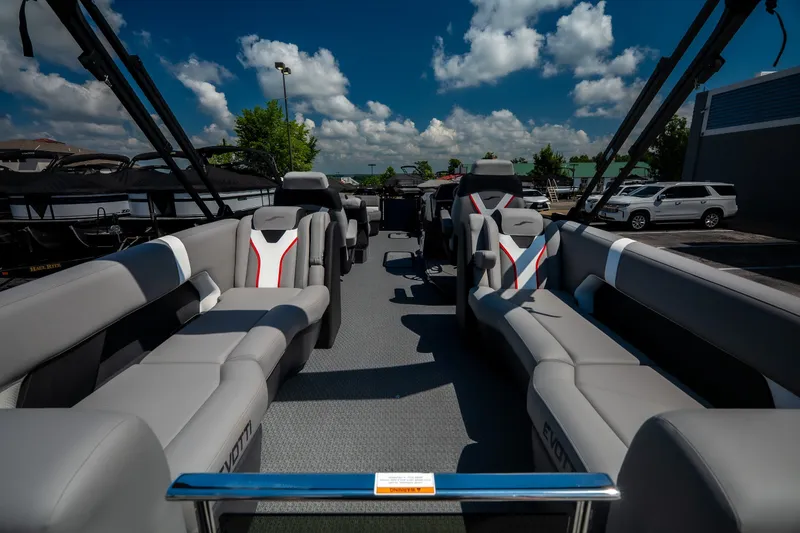 Slide: The Image of 2026 Evotti 725QL luxury boat interior with sleek gray seating under a vibrant blue sky. - 52