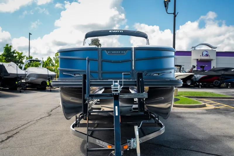 Slide: The Image of Evotti 725QL 2026 pontoon boat on trailer in dealership lot, sunny day. - 6