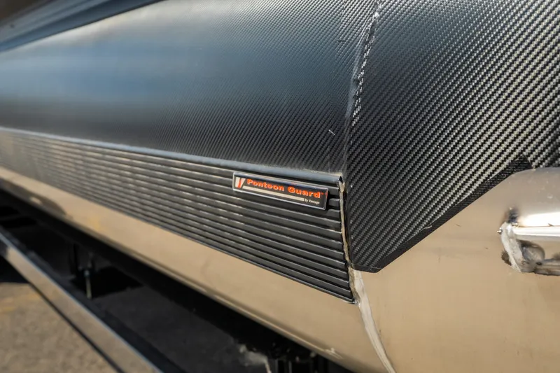Slide: The Image of Close-up of 2026 Evotti 725QL pontoon guard with carbon fiber texture. - 8