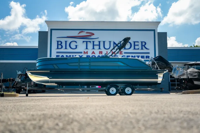 Slide: The Image of 2026 Evotti 725QL boat at Big Thunder Marine dealership under a blue sky. - 16