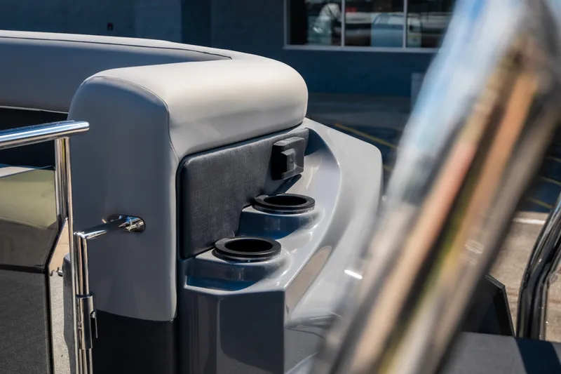 Slide: The Image of Interior detail of 2026 Evotti 725QL boat, featuring cup holders and sleek design elements. - 48