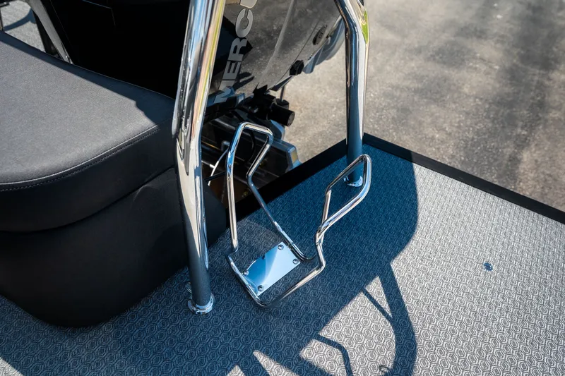 Slide: The Image of Chrome railing and seat on Evotti 725QL boat, 2026 model, with textured flooring. - 46