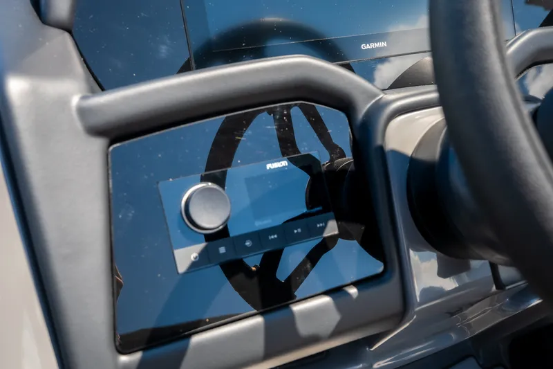 Slide: The Image of Dashboard of 2026 Evotti 725QL with Garmin and Fusion controls. - 25