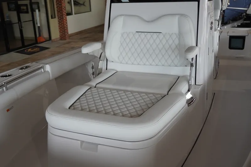 Slide: The Image of Luxurious seating on 2027 Sportsman Masters 267OE Bay Boat with diamond-stitched upholstery. - 17