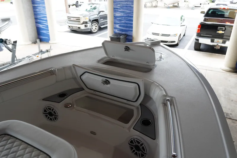 Slide: The Image of Interior view of a 2027 Sportsman Masters 267OE Bay Boat, showcasing storage compartments. - 14