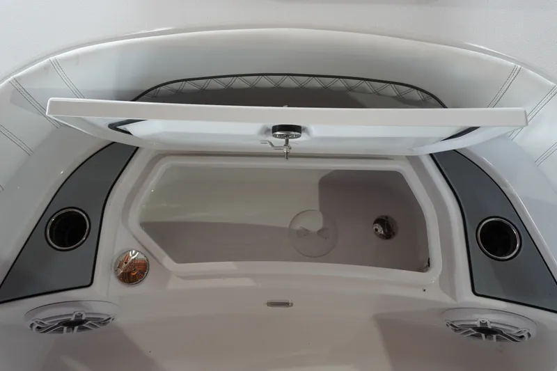 Slide: The Image of 2027 Sportsman Masters 267OE Bay Boat interior storage compartment with open lid. - 15