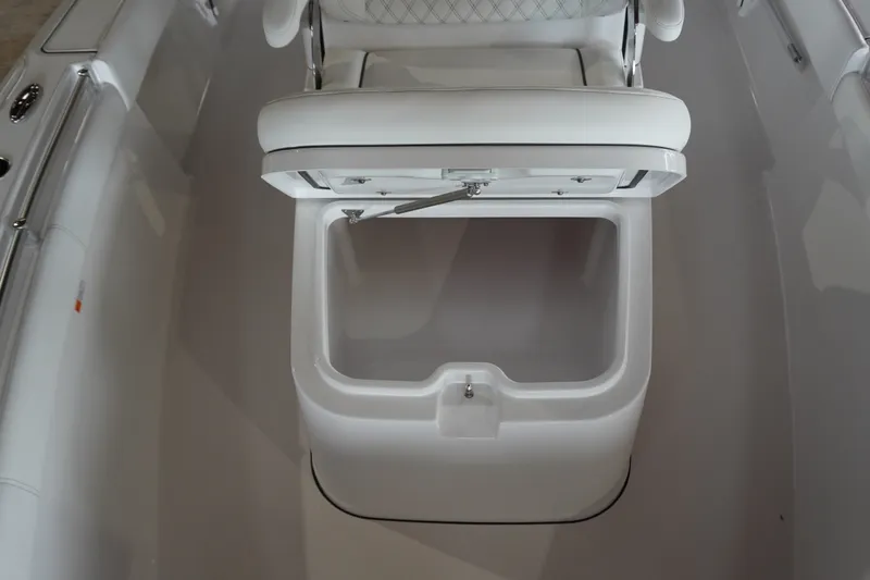 Slide: The Image of 2027 Sportsman Masters 267OE Bay Boat with open storage compartment. - 18