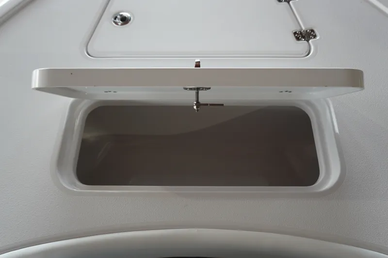 Slide: The Image of Open storage compartment on 2027 Sportsman Masters 267OE Bay Boat. - 16