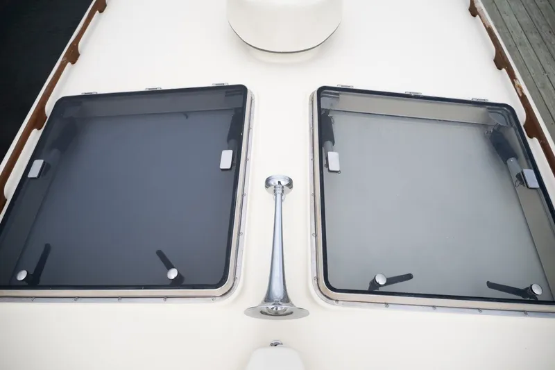 Slide: The Image of Hatch windows on 2009 Hinckley Picnic Boat 37 MKIII deck. - 25