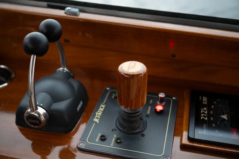 Slide: The Image of Hinckley Picnic Boat 37 MKIII 2009 dashboard with throttle and joystick controls. - 13