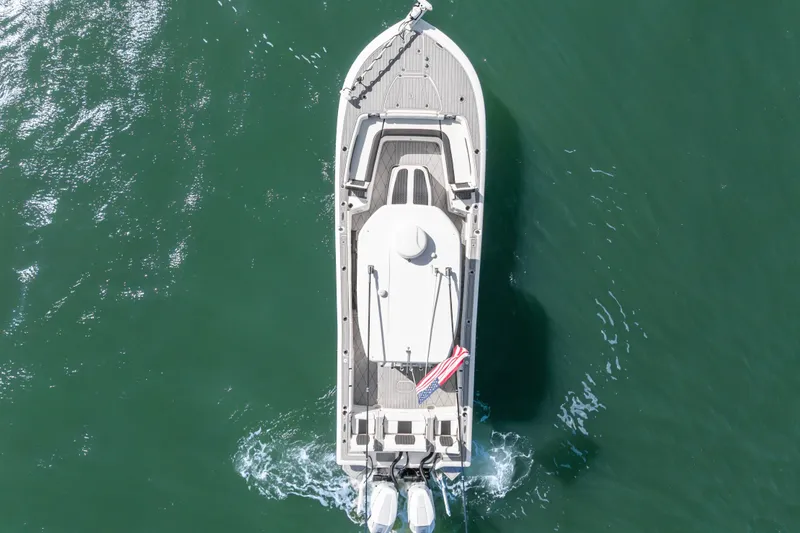 Slide: The Image of Aerial view of 2024 Tidewater 3100 Carolina Bay boat on green water. - 13