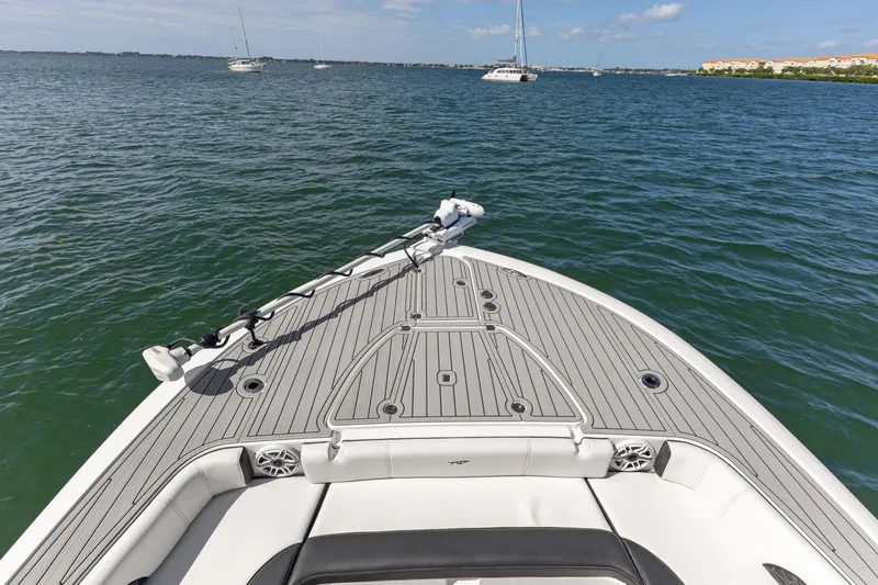 Slide: The Image of 2024 Tidewater 3100 Carolina Bay boat deck on calm waters, featuring sleek design. - 48