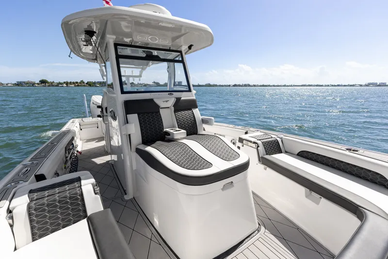 Slide: The Image of 2024 Tidewater 3100 Carolina Bay boat interior with sleek seating and ocean view. - 50