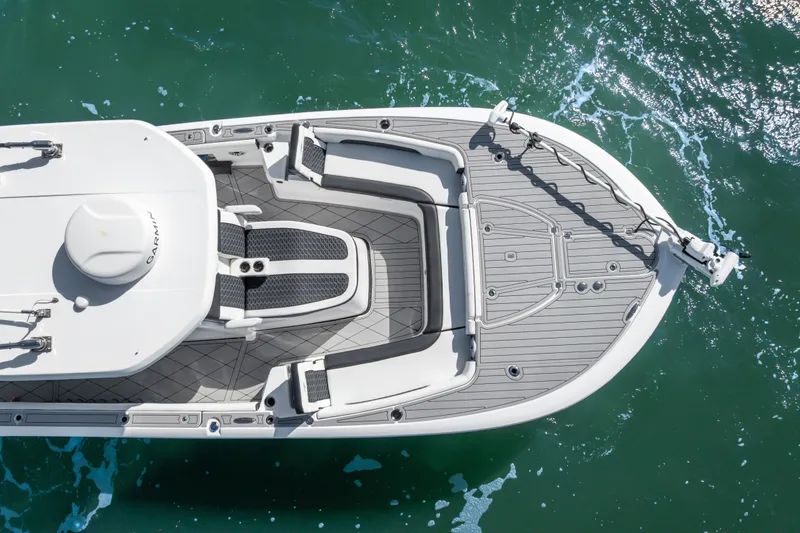 Slide: The Image of 2024 Tidewater 3100 Carolina Bay boat deck on turquoise water, aerial view. - 12