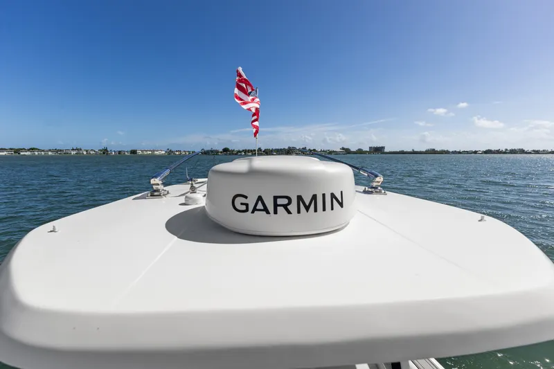 Slide: The Image of 2024 Tidewater 3100 Carolina Bay boat with Garmin equipment on open water. - 53