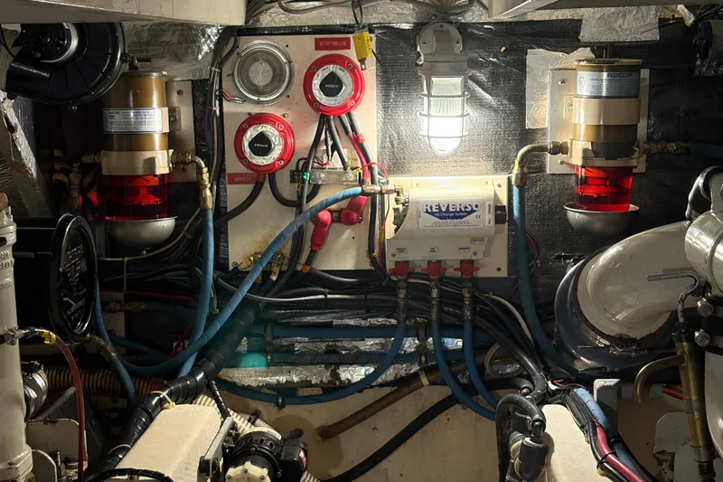 Slide: The Image of Engine room of 1989 Chris-Craft 427 Catalina with wiring and oil change system. - 50