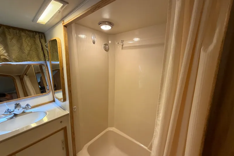 Slide: The Image of Bathroom interior of 1989 Chris-Craft 427 Catalina yacht with shower and sink. - 59