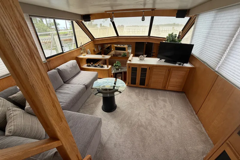 Slide: The Image of Luxurious interior of 1989 Chris-Craft 427 Catalina yacht with cozy seating and modern amenities. - 27