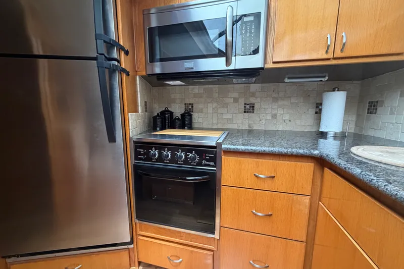 Slide: The Image of Modern kitchen in 1989 Chris-Craft 427 Catalina yacht with stainless steel appliances. - 41
