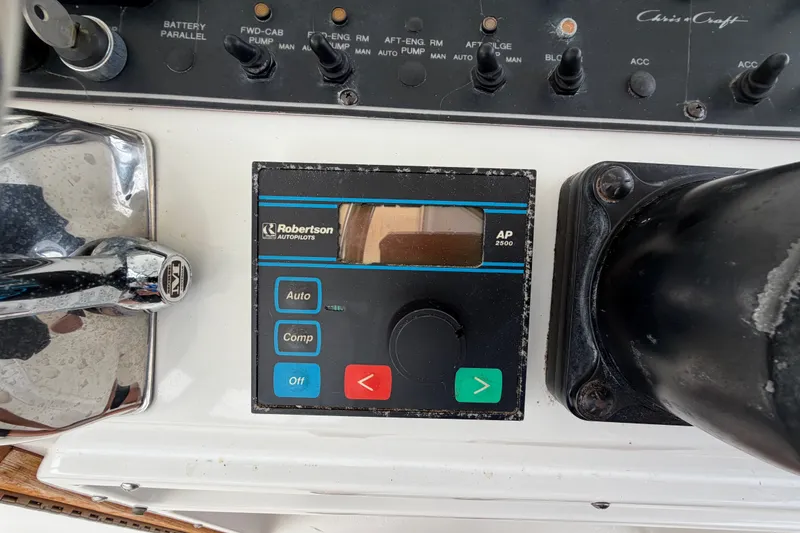 Slide: The Image of Control panel of a 1989 Chris-Craft 427 Catalina with Robertson autopilot system. - 19