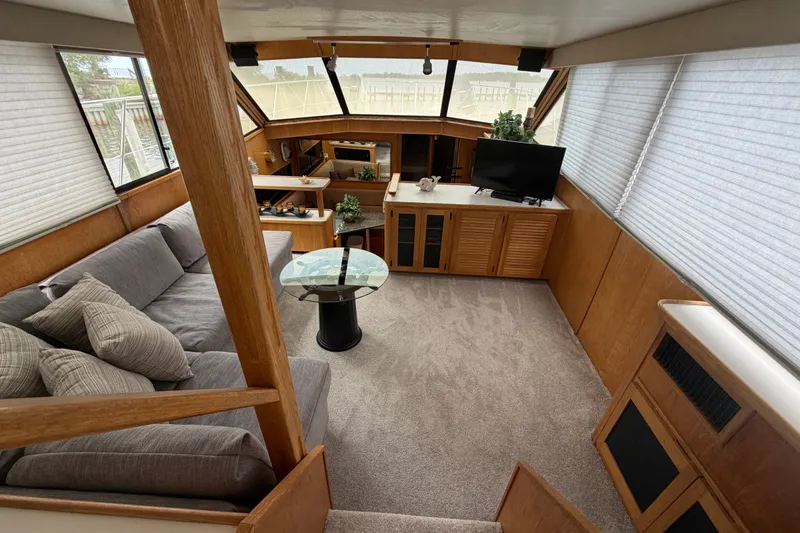 Slide: The Image of Luxurious interior of 1989 Chris-Craft 427 Catalina yacht with cozy seating and modern amenities. - 26