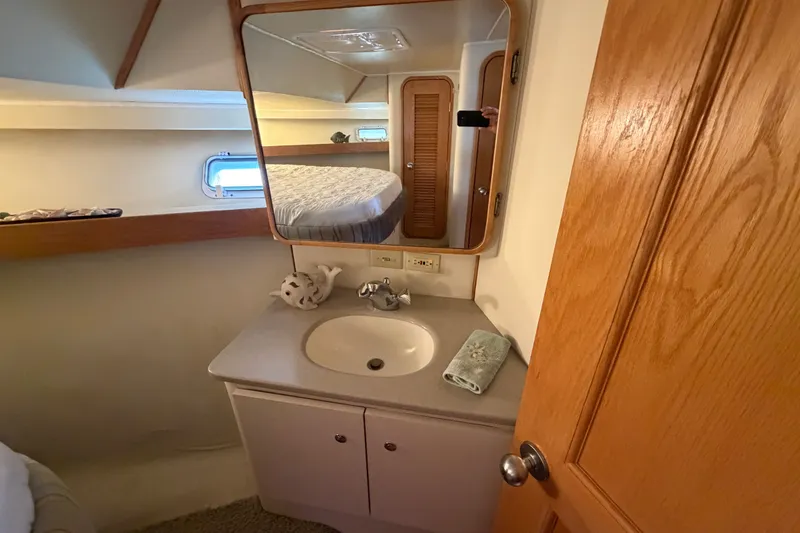 Slide: The Image of Bathroom interior of 1989 Chris-Craft 427 Catalina yacht with sink and mirror. - 46