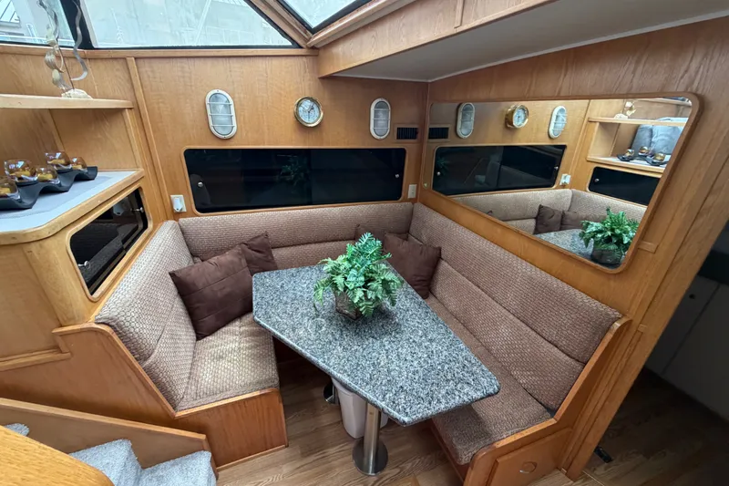 Slide: The Image of 1989 Chris-Craft 427 Catalina interior with cozy seating and elegant decor. - 37