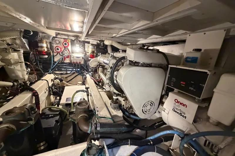 Slide: The Image of Engine room of 1989 Chris-Craft 427 Catalina with Onan marine generator and complex wiring. - 48