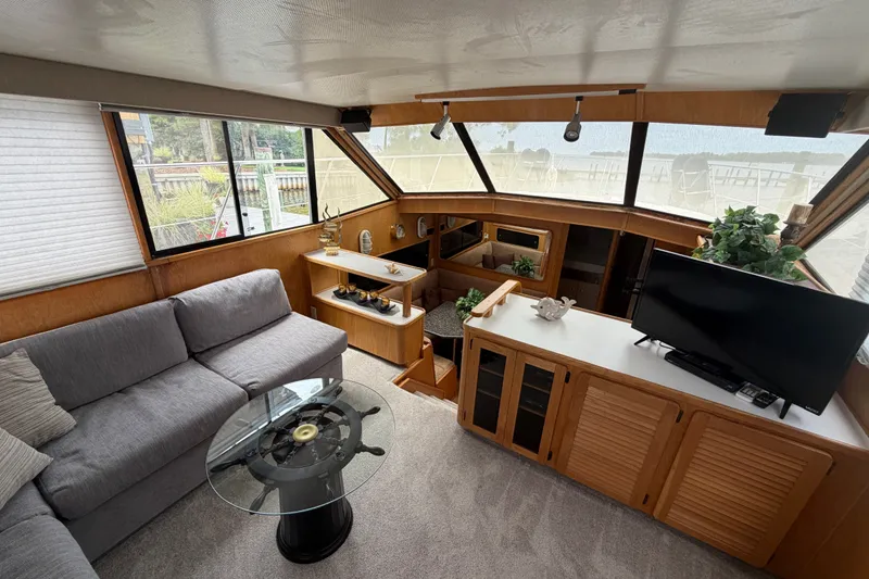 Slide: The Image of Interior of 1989 Chris-Craft 427 Catalina yacht with cozy seating and modern decor. - 28