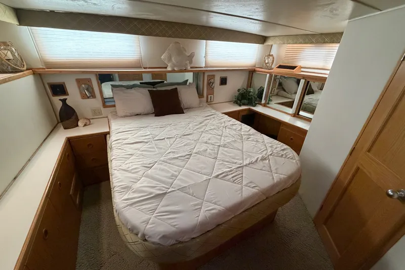 Slide: The Image of Cozy bedroom interior of 1989 Chris-Craft 427 Catalina yacht with elegant decor. - 56