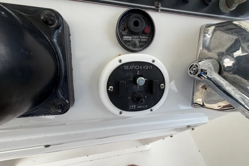 Slide: The Image of Control panel of a 1989 Chris-Craft 427 Catalina with searchlight and engine shutdown system. - 20