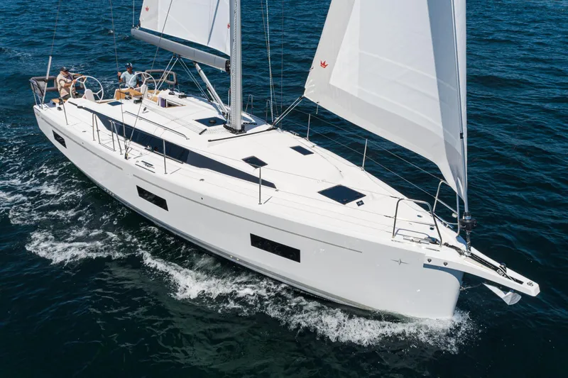 Slide: The Image of 2023 Bavaria C42 sailing yacht cruising on open water. - 14