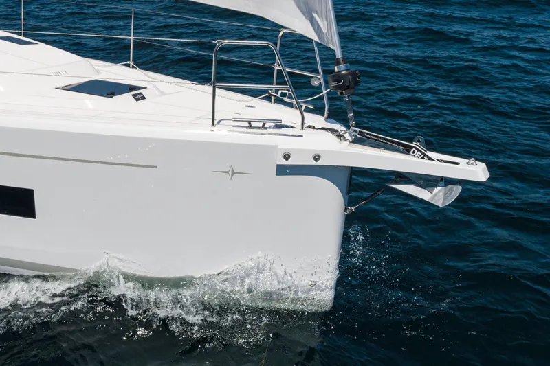 Slide: The Image of 2023 Bavaria C42 yacht sailing on open water, showcasing sleek design and modern features. - 16