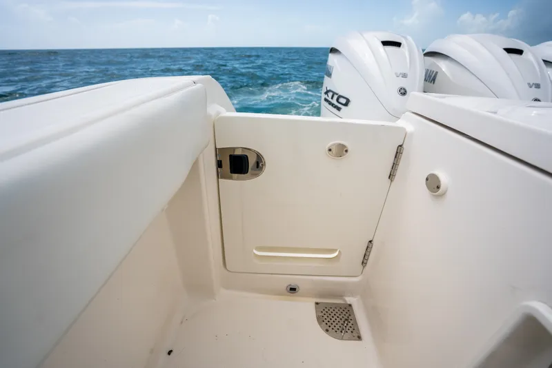 Slide: The Image of 2025 Pursuit OS 405 Offshore boat with Yamaha V8 engines on open sea. - 27