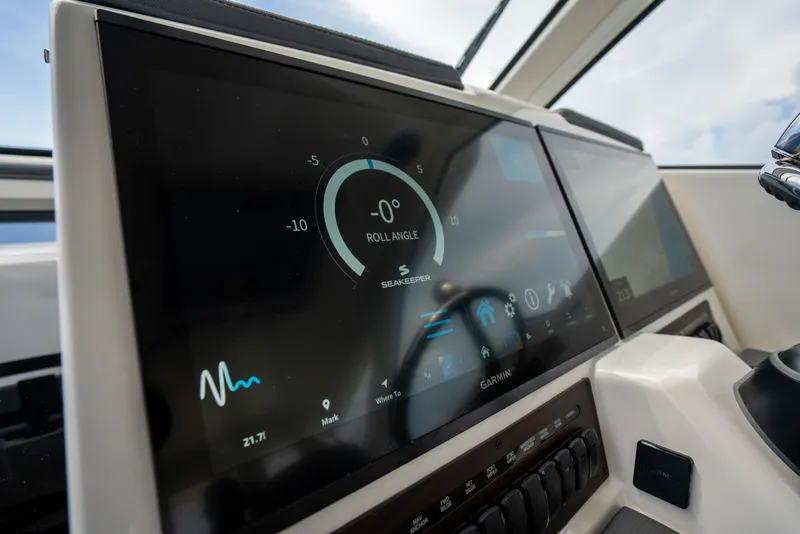 Slide: The Image of Dashboard of 2025 Pursuit OS 405 Offshore boat with advanced navigation display. - 40