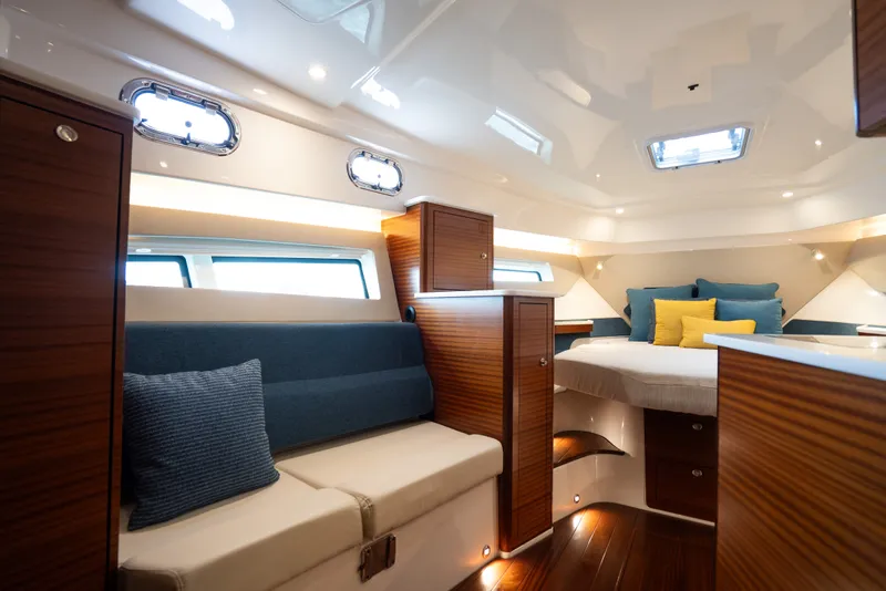 Slide: The Image of Luxurious interior of 2025 Pursuit OS 405 Offshore yacht with elegant wood finishes. - 57