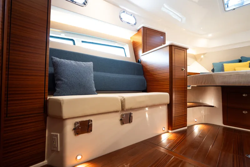 Slide: The Image of Luxurious interior of 2025 Pursuit OS 405 Offshore yacht with elegant wood finishes. - 56