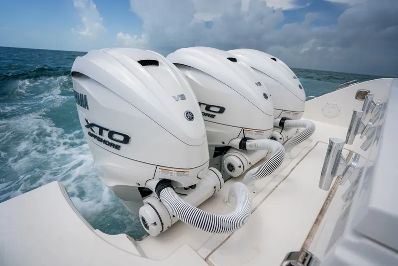 Slide: The Image of 2025 Pursuit OS 405 Offshore boat with triple Yamaha XTO V8 engines. - 26